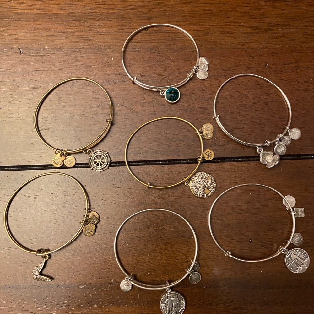 7 Alex and Ani bracelets.